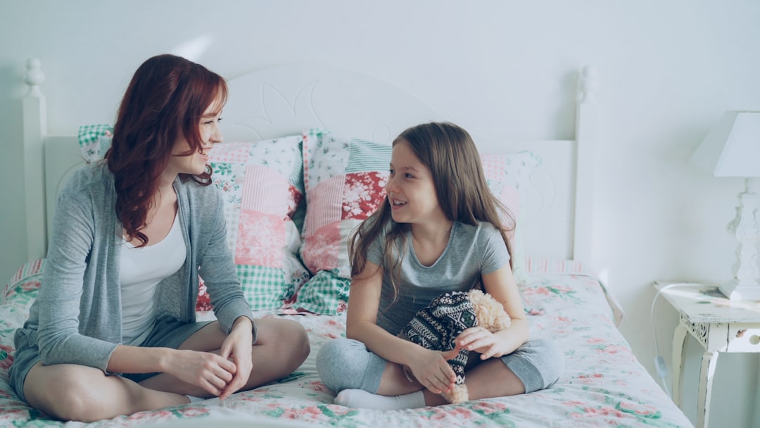 A parent and child sharing a warm conversation at home