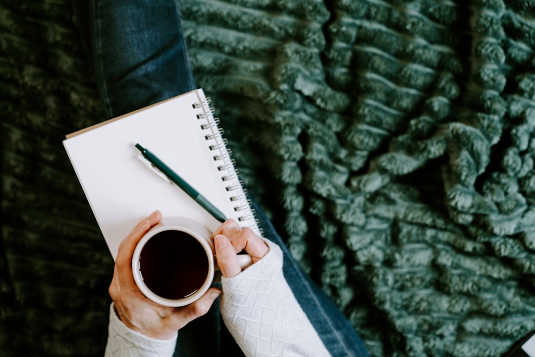 A person journaling with a cup of coffee, a hopeful new beginning