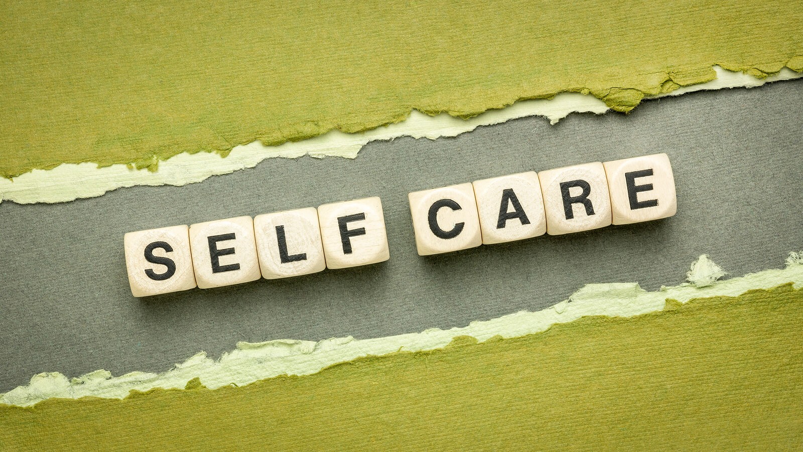 Scrabble letters spell Self Care to represent the importance of therapy for relationship problems in the Portland Oregon area. Connect with a therapist Tigard 97223.