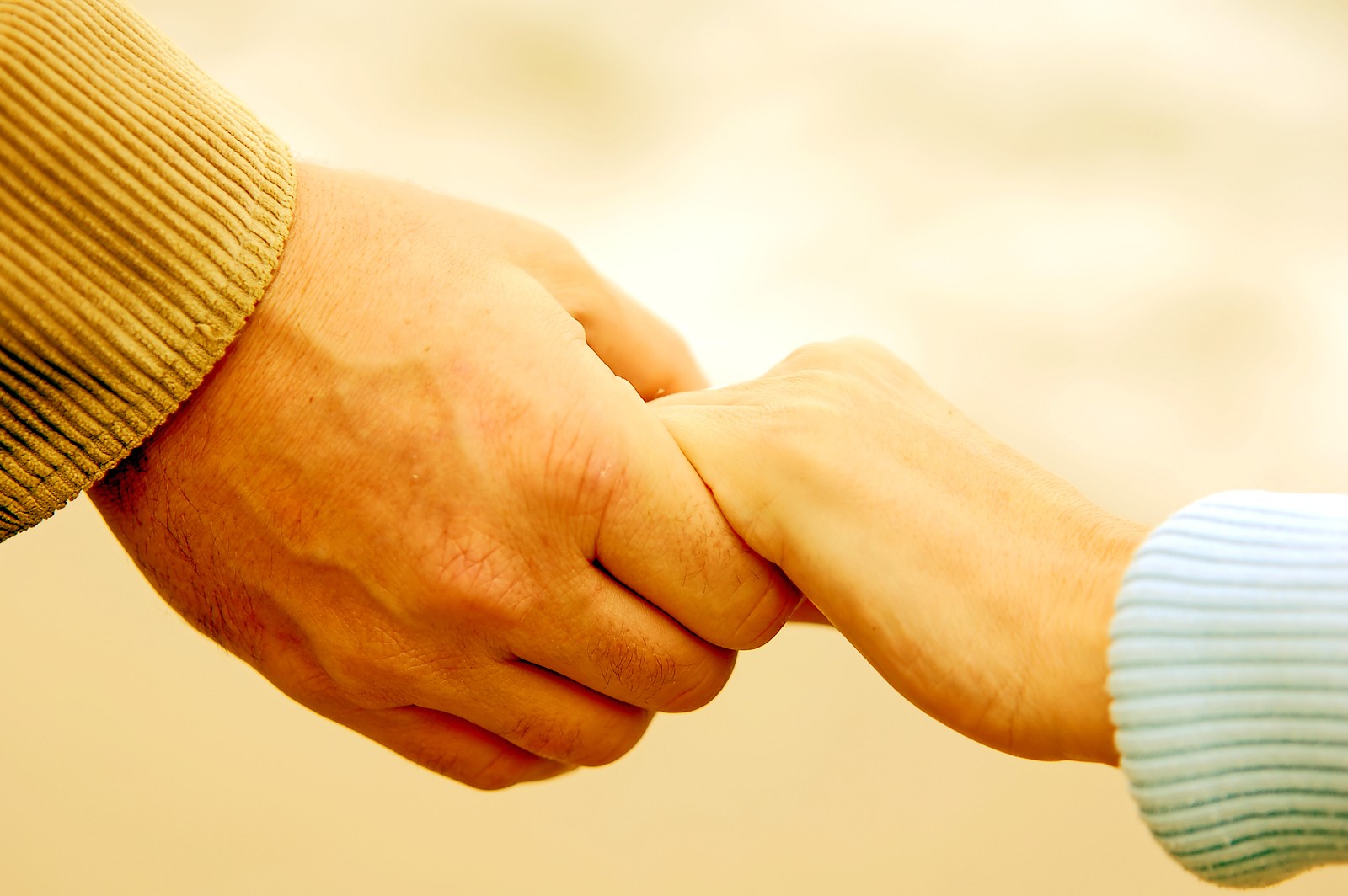 Holding Hands on the Beach for Codependency Therapy in Tigard, OR 97223 at Discover Counseling near Portland, OR