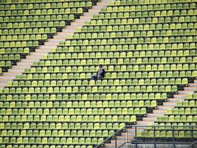 One person in an empty set of stands to show how even sports have stopped during Covid 19. Our Tigard, OR therapists are here to help you cope with anxiety and depression through online counseling.