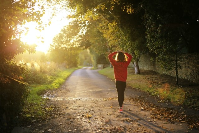 Woman walking on a road to represent how grief and loss are a journey our Tigard, OR therapists can help with.