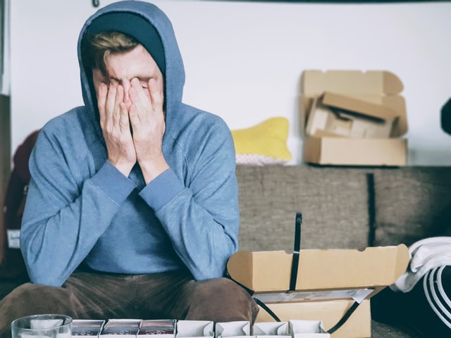 man with hands over face appears stressed, anxious or worried. Counseling for anxiety in Oregon can help with Discover Counseling in Tigard, OR. Discover hope with online therapy in Oregon!