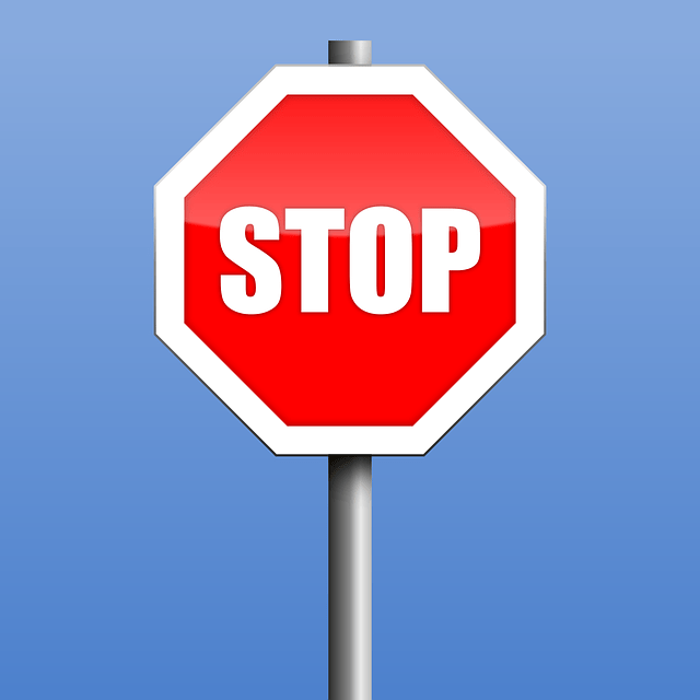 stop sign on blue background. Stop your anxious and worried thoughts with therapy for anxiety in Tigard, OR. Discover hope with online counseling in Oregon.