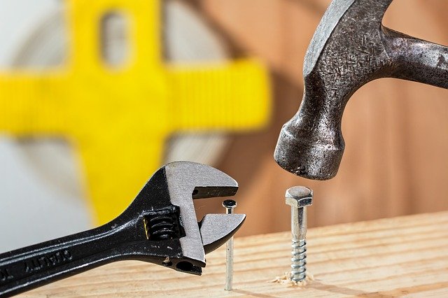 Hammer hitting a screen and wrench on a nail, on the same piece of wood. Not using the right tools can make social anxiety in Tigard, OR worse. You can get help for anxiety, grief and loss, and life transitions during COVID 19 with online therapy in Oregon here!