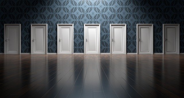 A line of doors for choices for couples. You can get help with couples therapy in Tigard, OR. Online therapy in oregon can help with couples counseling too.