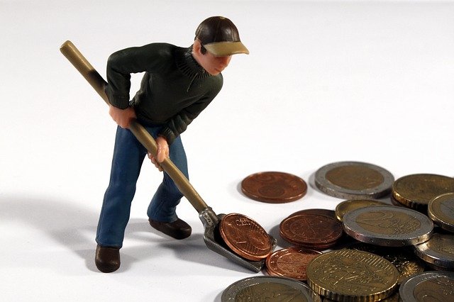 Toy man pushing coins with a toy shovel. Stop throwing money away on unnecessary tests and medical procedures when counseling in Tigard, OR could help. Anxiety, depression, codependency, couples therapy, and more can be helped with online therapy in Oregon.