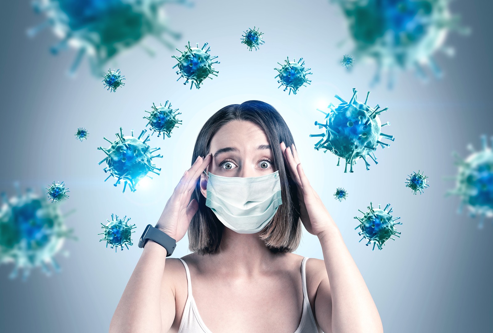 Woman wearing mask looking stressed as germs fly around her. COVID 19 stress and health anxiety can cause depression and other issues that can be dealt with in counseling in Tigard, OR with an online therapist in Oregon.