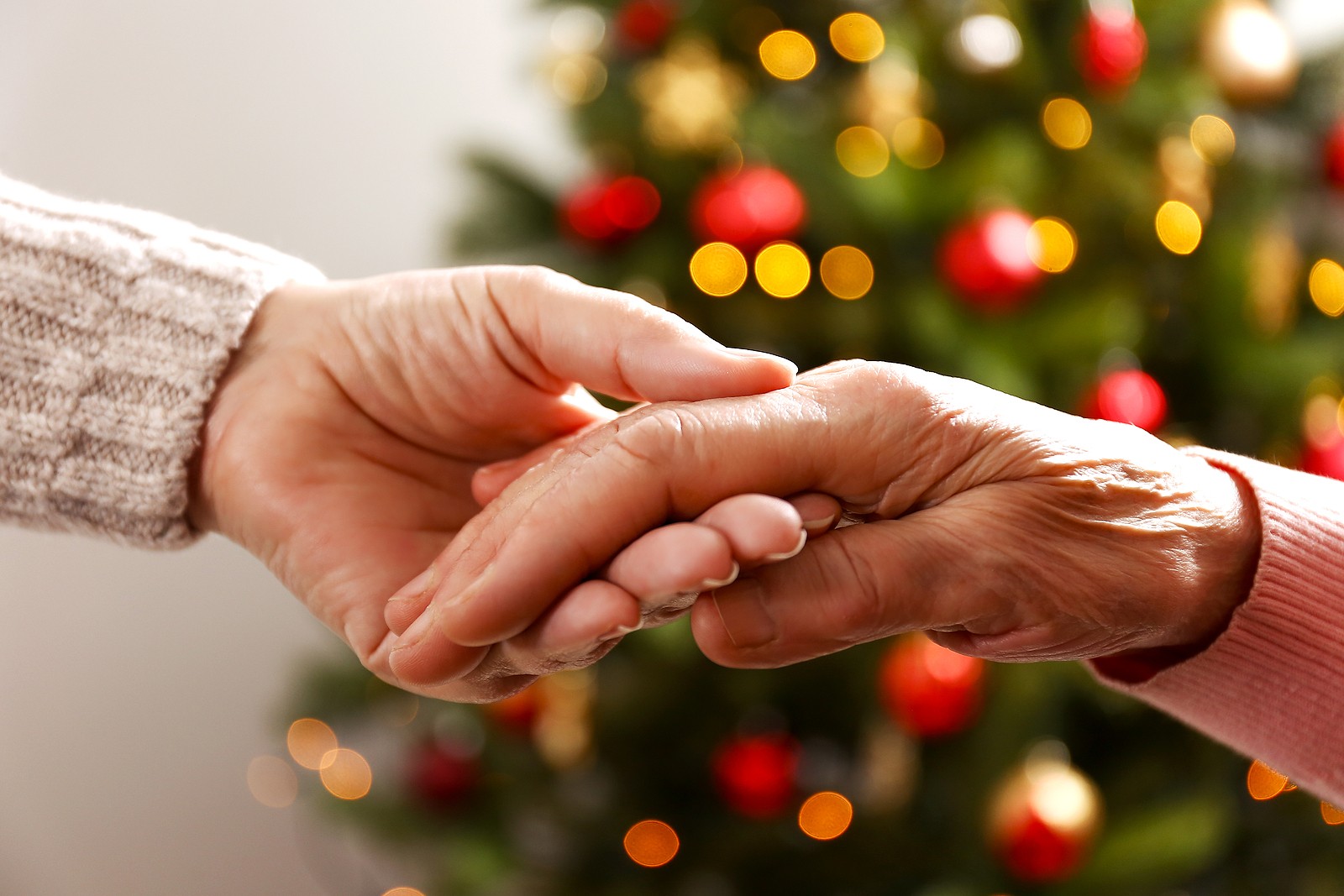 Image of person holding hands with family member. If you’re feeling stressed about family right now, therapy for relationship issues may be for you. Our online therapist in Oregon can help you with that and stress counseling in Tigard, OR. (97223)