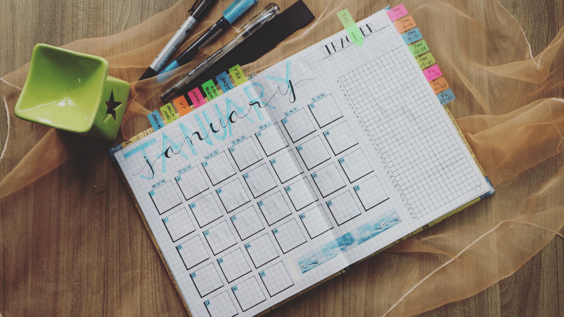 Image of a calendar open to January with lots of colorful tabs on it. Getting 'less busy' doesn't have to be hard with help online therapy in Oregon. Don't waste time with your loved ones. Call today to start counseling in Tigard, OR 97223.