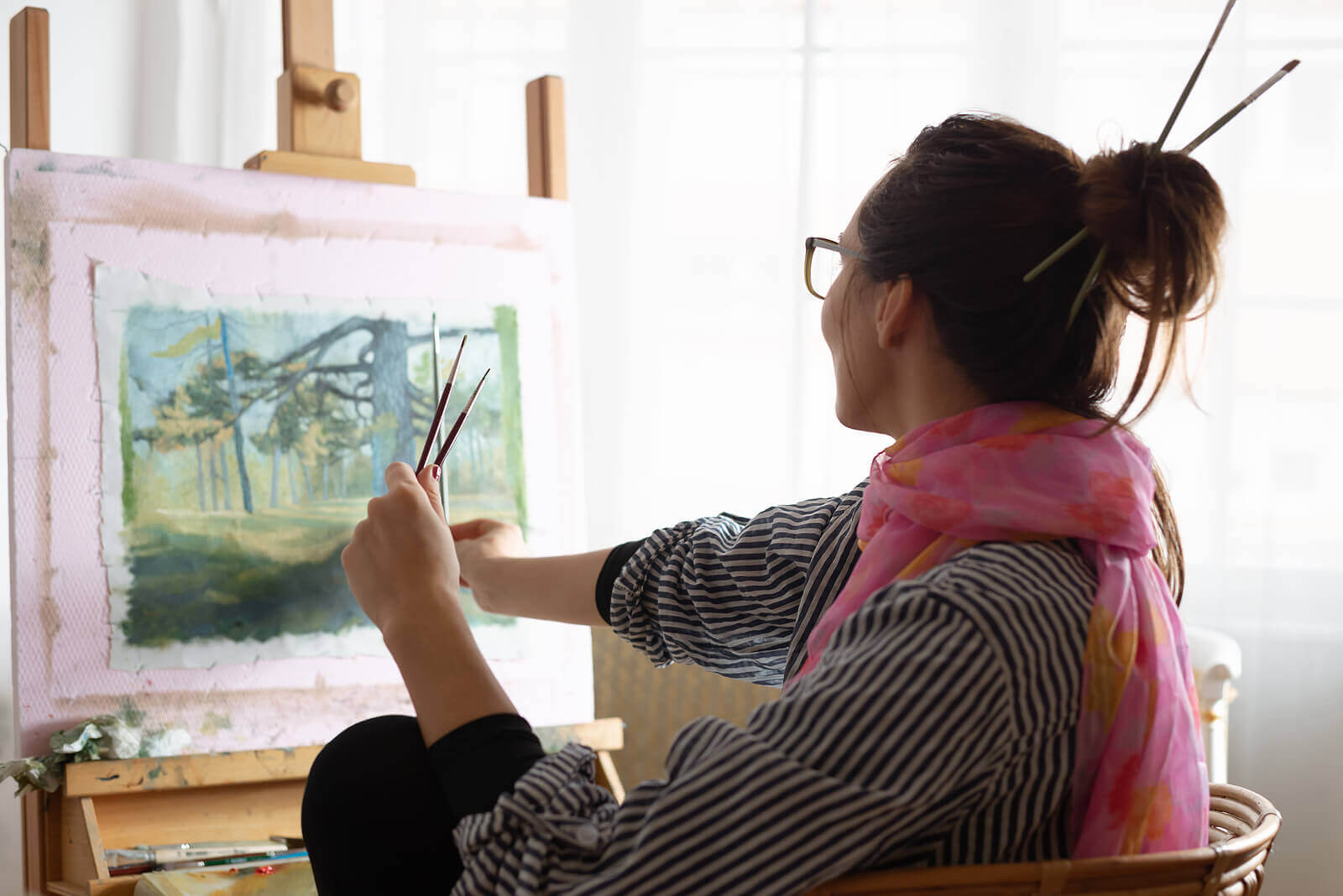 Image of a woman painting while wearing a pink scarf. Could you use help overcoming your perfectionism with an online therapist in Oregon? Online therapy is a great way to find your balance. Reach out now to start online counseling in Oregon.