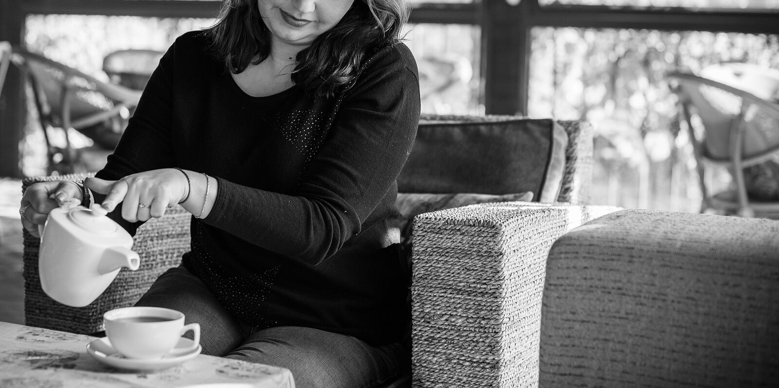pouring tea | christian therapist in tigard, or | grief counseling in tigard, or | therapy in tigard, or | 97223 A woman in a seat pours tea while smiling. This could symbolize the mindfulness cultivated through therapy in Tigard, OR. Learn more about grief counseling in Tigard, OR and the support online counseling in Oregon can offer.