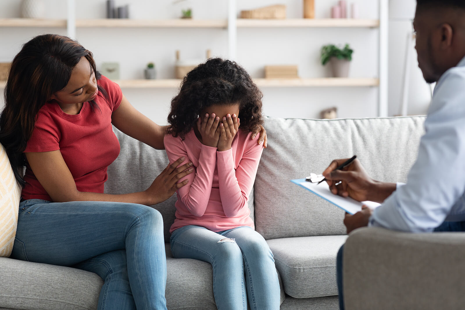 covering face | child therapist in tigard, or | child counseling in tigard, or | child therapist near me | 85016 | 85085 | 85260 A child covers her face while being comforted by their mother. Learn how a child therapist in tigard, or can offer support with child therapist near me, and other services. Search for child counseling in tigard, or to learn more about family Christian counseling center of Phoenix today.