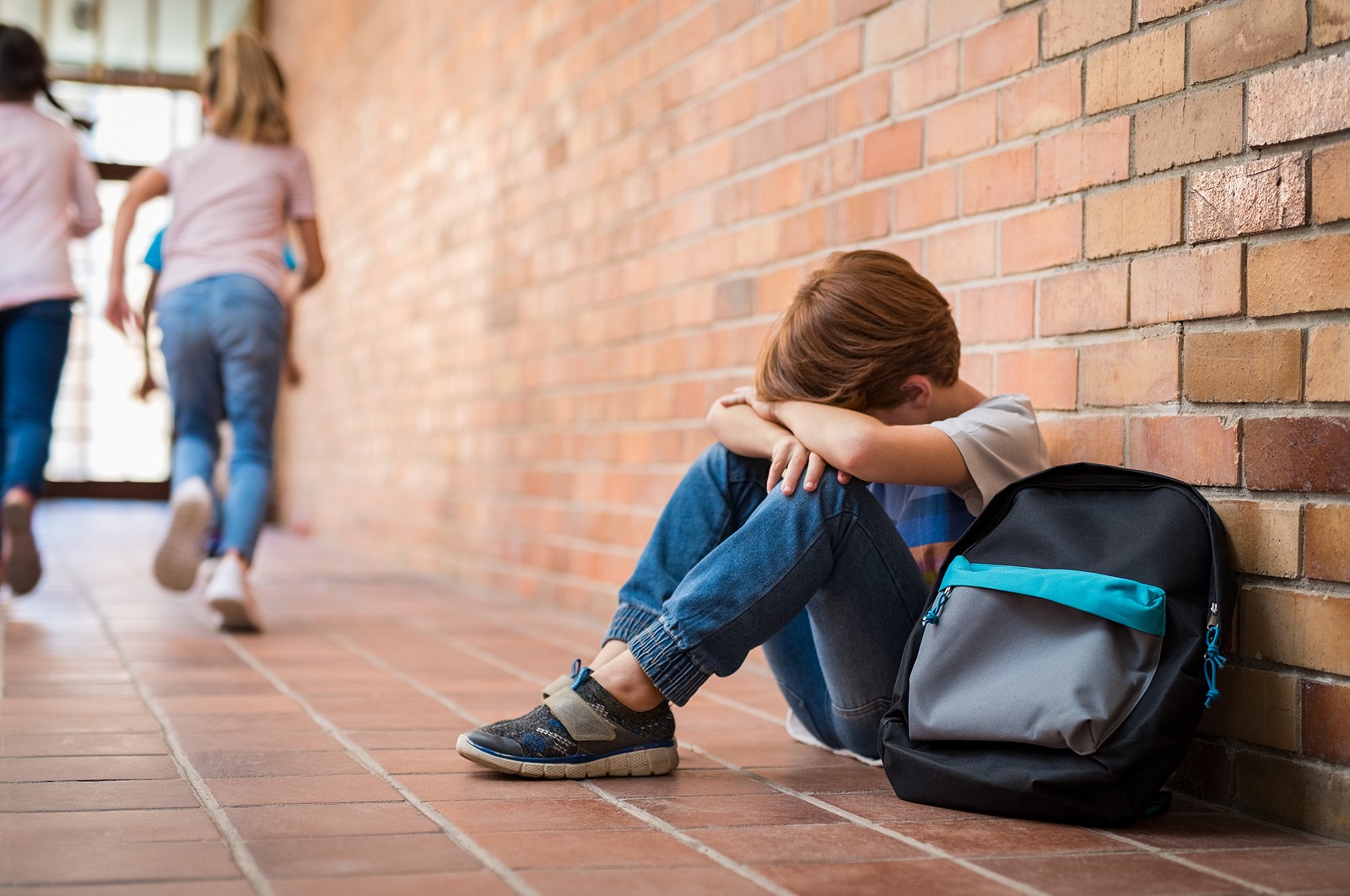 sitting alone | child therapist in tigard, or | child counseling in tigard, or | child therapist near me | 85016 | 85085 | 85260 A child sits against a hallway wall while covering their face. This could represent the isolation that a child therapist in tigard, or can address. Learn more about child counseling in tigard, or, and other services by searching “child therapist near me” today.