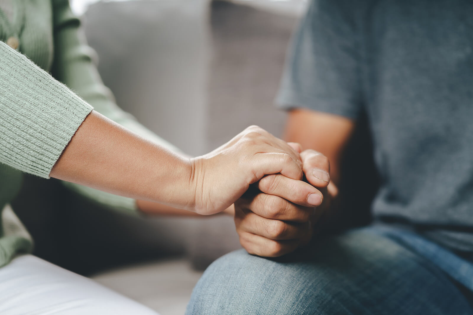 supportive hand | relationship therapy in tigard, or | online therapist in orgeon | christian therapist in tigard, or | 97223 A close up of a person holding the hand of another which represents the support relationship therapy in Tigard, OR can offer with vulnerability. Contact an Oregon online therapist to learn more about therapy for relationship issues and more.