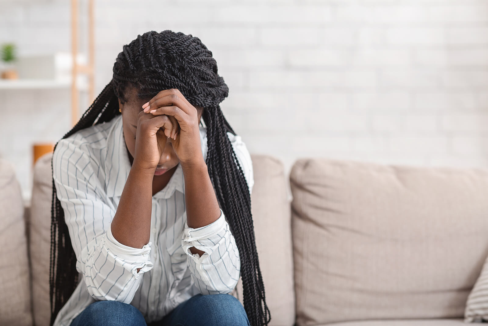 stressed woman | therapy for depression tigard, or | online therapist in oregon | postpartum depression help in tigard, or | 97223 | 97224 | 97281 A woman rests her hands against her head with a stressed expression. Learn how counseling for depression Tigard, OR can support you by contacting an online therapist in Oregon today or searching for postpartum depression help in Tigard, OR.