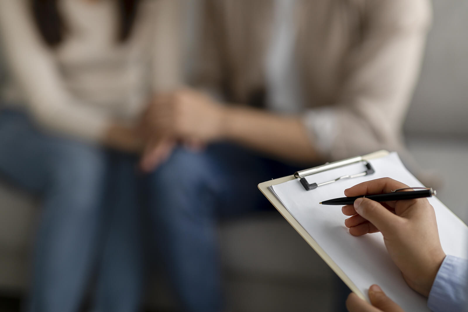 clipboard | online therapist in oregon | relationship issues therapy | relationship issues therapy in tigard, or | 97268 | 97269 | 97270 A close up of a person writing on a clipboard while sitting across from a couple. This could symbolize the support an online therapist in Oregon can offer. Learn more about relationship therapy in Tigard, OR and the support therapy for relationship issues can offer today.