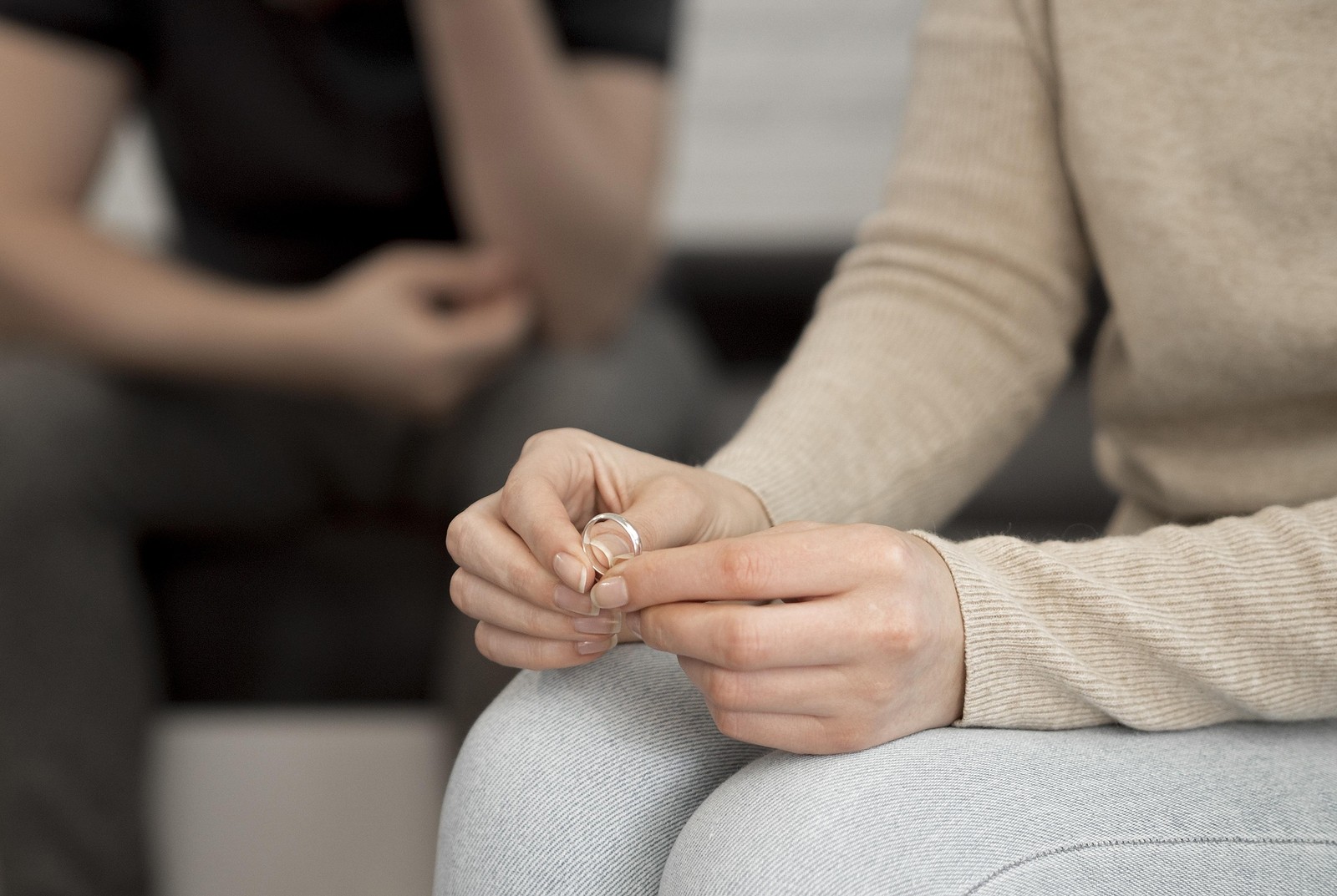holding ring | codependency counseling | codependency counseling near me | codependency resources | 97223 | 97224 | 97281 A close up of a person holding a wedding ring while sitting near their partner. Search for codependency counseling near me to learn more about online therapy for codependency and other codependency resources.