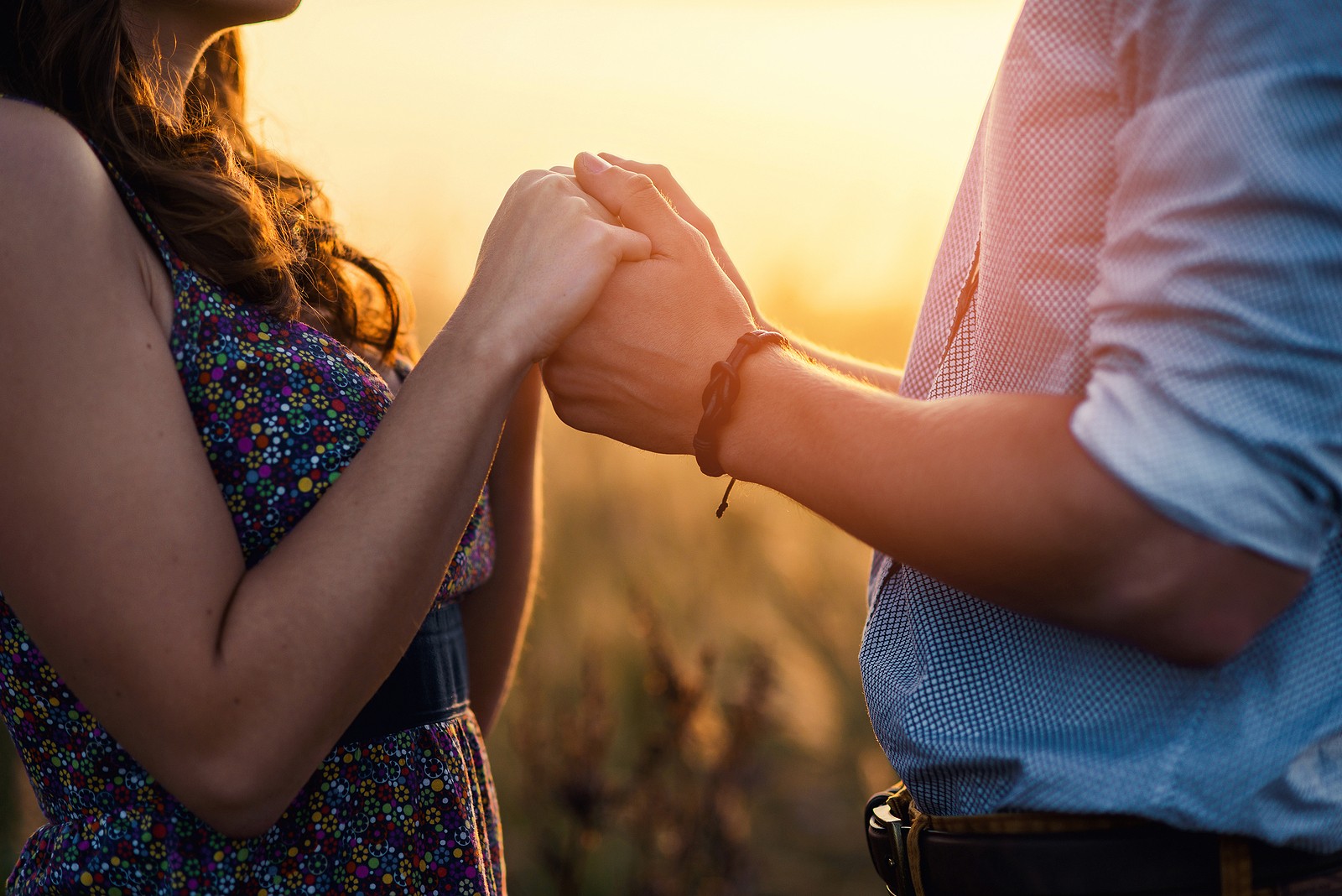 holding hands | couples therapy in tigard, or | codependency therapist in tigard, or | couples therapist in tigard, or | 97223 | 97224 | 97281 A close up of a couple holding hands in the light of the setting sun. This could symbolize the bonds cultivated in overcoming issues with couples therapy in Tigard, OR. Learn more about the help a couples therapist in Tigard, OR can offer or search for "couples counseling Tigard, OR today.