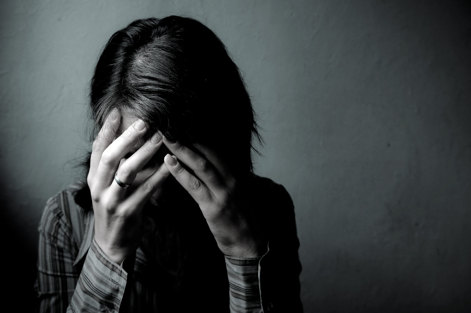 covering face | trauma therapy in tigard, or | trauma therapy tigard, or | online therapist in oregon | 97223 | 97224 | 97281 A close up of a woman covering her face. This could symbolize the stress of trauma therapy in Tigard, OR that trauma counseling in Tigard, OR can help you address. Learn more by searching for therapist Tigard or "trauma recovery in Tigard, OR" today.