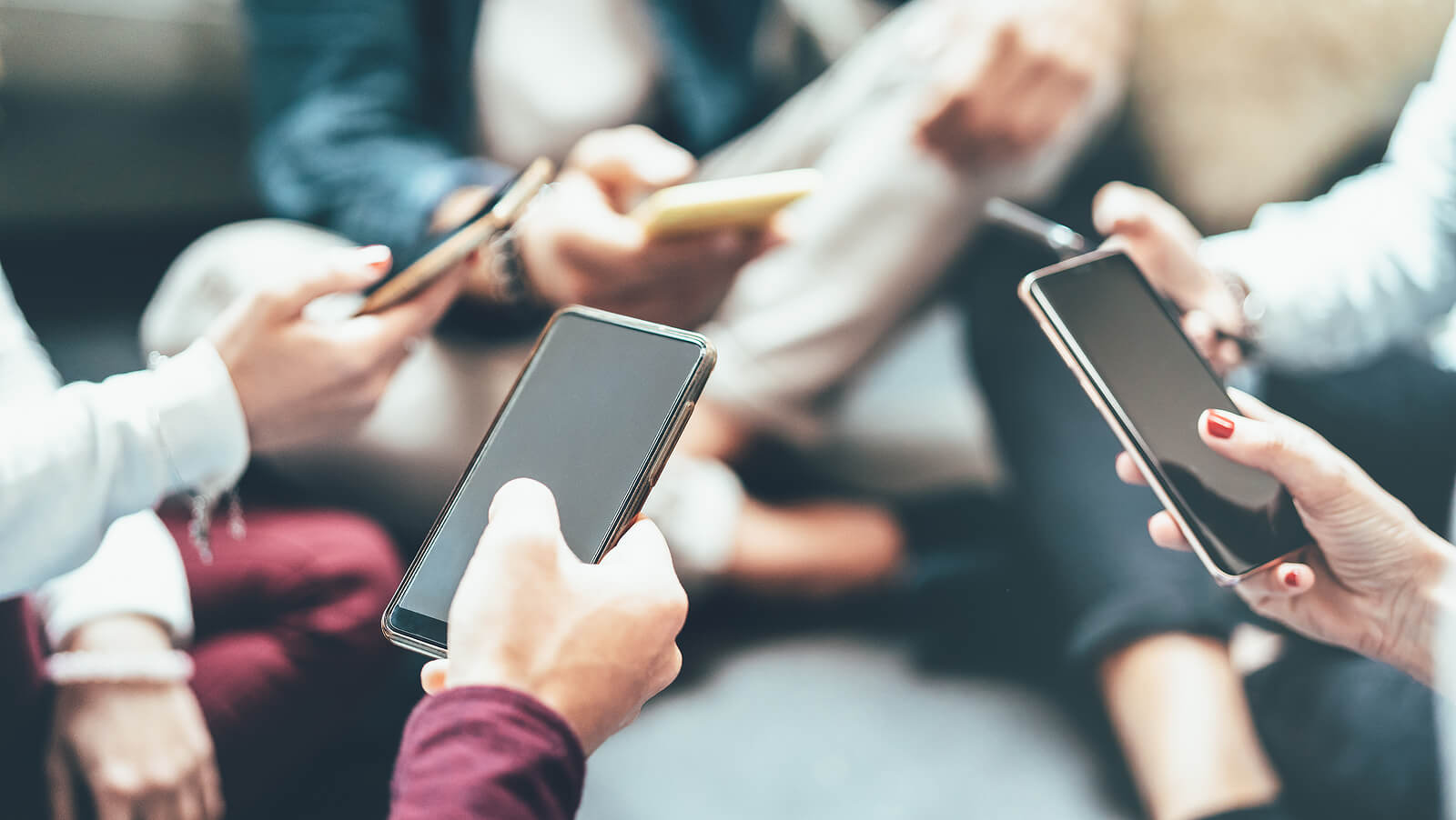 friends on phones | codependency therapist in tigard, or | online therapy for codependency | codependency counseling | 97223 | 97224 | 97281 A close up of people sitting in a circle while typing on their phone screens. This could represent the pervasiveness of social media that a codependency therapist in Tigard, OR can help you address. Learn more about online therapy for codependency or search for codependency counseling Tigard, OR to learn more.