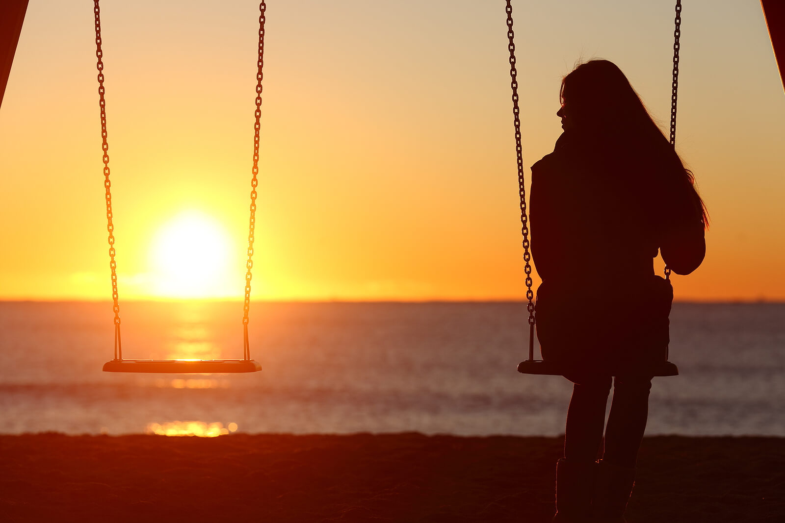 A woman sits alone in a swing set while looking at the nearby empty seat. Learn more about how relationship counseling in Tigard, OR can offer support with overcoming toxic relationship concerns. Contact an online therapist in Oregon to learn more about therapy for relationship issues and other services. 
